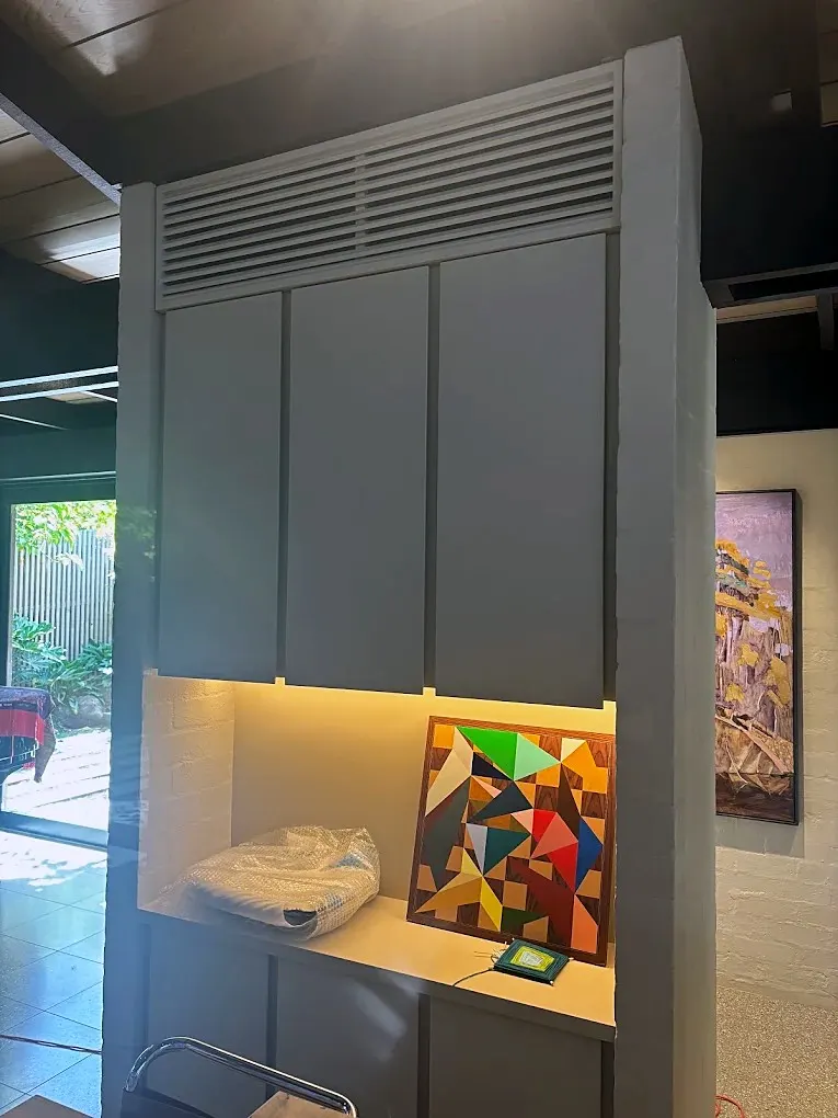 Return-air grille built into custom joinery